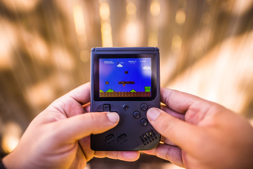 Shallow Focus Photo of Gameboy Console